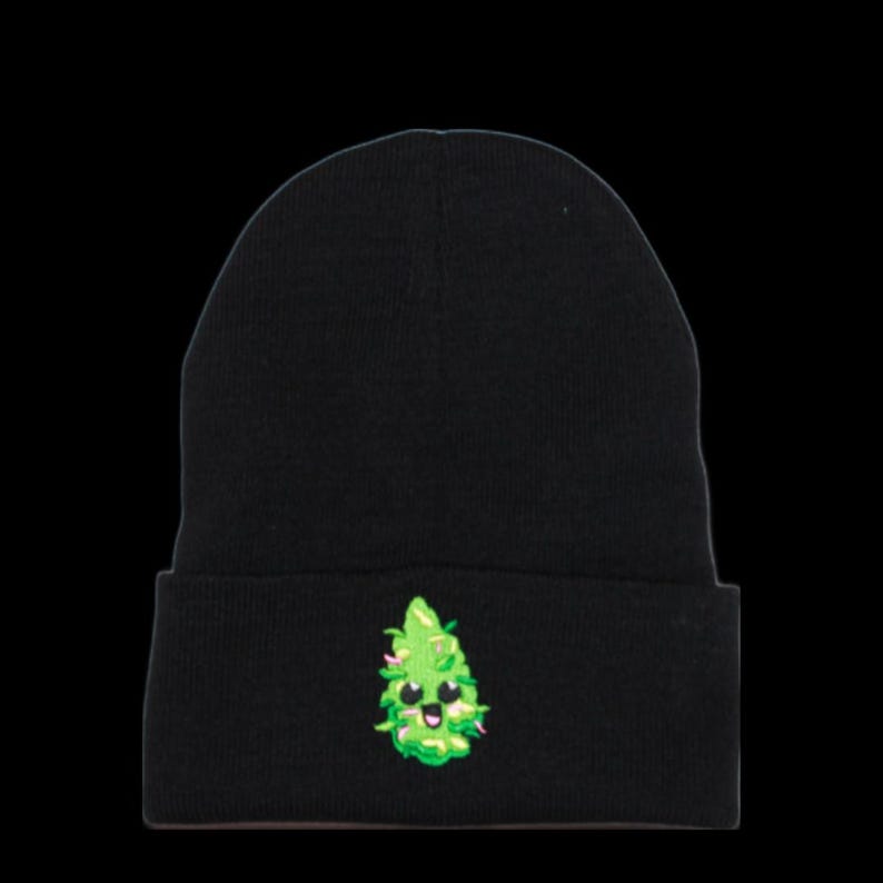 May include: Black beanie with a green cartoon marijuana leaf with a smiling face embroidered on the front.