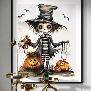 May include: A framed watercolour print depicting a Halloween scarecrow with a top hat, striped shirt, and pumpkins. The artwork has a dark colour palette and a whimsical style, perfect for the spooky season.