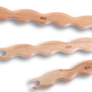 May include: Three wooden weaving looms of different sizes. The looms are made of natural wood and have a wavy shape. The looms are labeled "ahkl" on the side.