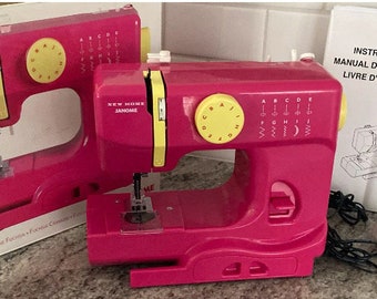 Janome New Home Fast Lane Fuchsia 525B Sewing Machine Works Great! W/ Extras! Includes box, manual, foot pedal and electrical cord!