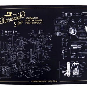 May include: Black rectangular mat featuring a detailed schematic diagram of a Singer Featherweight sewing machine. The mat includes the text "The Featherweight Shop" and "Schematics for the Singer Featherweight" in gold lettering. The website address is also visible.
