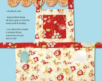 May include: A red and white floral apron with a scalloped edge and a large pocket. The apron is designed for working girls and hipsters. The text "Working Girl Apron & Hipster Apron" is printed on the top of the image. The text "#187-WGA" is printed on the bottom right corner of the image.