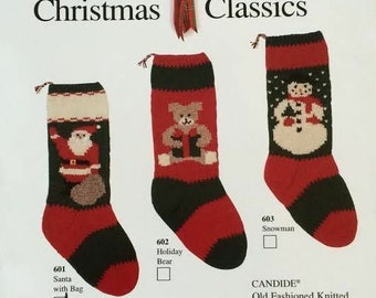 May include: Three knitted Christmas stocking kits with different designs: Santa with a bag, a holiday bear, and a snowman. Each kit includes 100% pure wool yarn, knitting instructions, and a letter and number chart to personalize the stocking with a name and year. Finished stocking size is approximately 7 inches by 22 inches. Size 8 knitting needles are required, but not included in the kit.