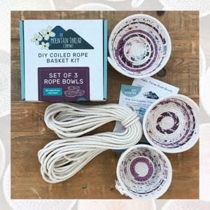 May include: A DIY coiled rope basket kit with three finished rope bowls, a roll of white rope, and instructions. The kit includes everything needed to make three rope bowls.