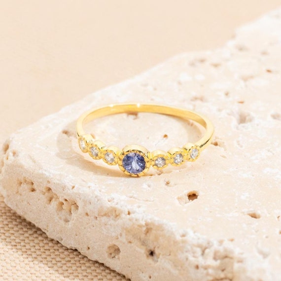 14k Gold Tanzanite and Diamond Ring: Round Bezel Setting