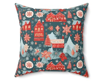 Könnte beinhalten: Quadratisches Kissen mit einem festlichen Weihnachtsdorfmuster. Das Design zeigt rote Häuser, Schneeflocken und Weihnachtsbäume auf tealfarbenem Hintergrund. Dekokissen für die Inneneinrichtung.