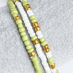Olive Bracelet set of 3. Olive green, gold and white combination. Elasticated beaded boho style Unique, pretty, Stretch bracelet. Stackable.