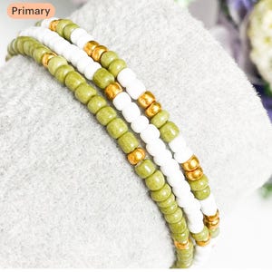 Beaded Bracelet set of 3. Olive green, gold and white. Elasticated boho style Unique, pretty, Stretch bracelet. Stackable. Boho
