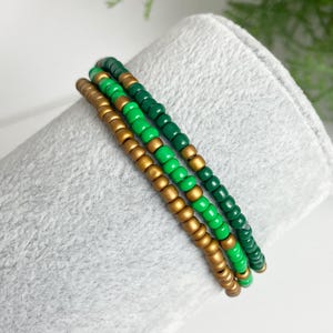 Green Beaded Bracelet, Green and matte gold combination. Elasticated boho style Unique, pretty, Stretch, Stackable, festival bracelet.