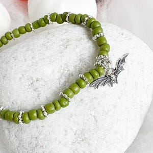 Halloween bracelet, Olive green Gothic bat bracelet, chunky beaded spooky bracelet, stylish goth gift, stretch bracelet, Halloween gift.