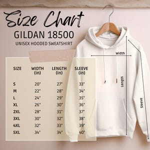 May include: Cream-colored Gildan 18500 unisex hooded sweatshirt hanging on a wooden hanger. A size chart displays measurements in inches for width, length, and sleeve length, ranging from size S to 5XL. The chart includes the text "Size Chart" and "UNISEX HOODED SWEATSHIRT."