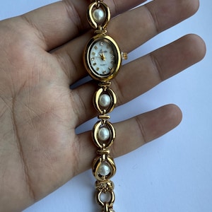 gold and pearls watch