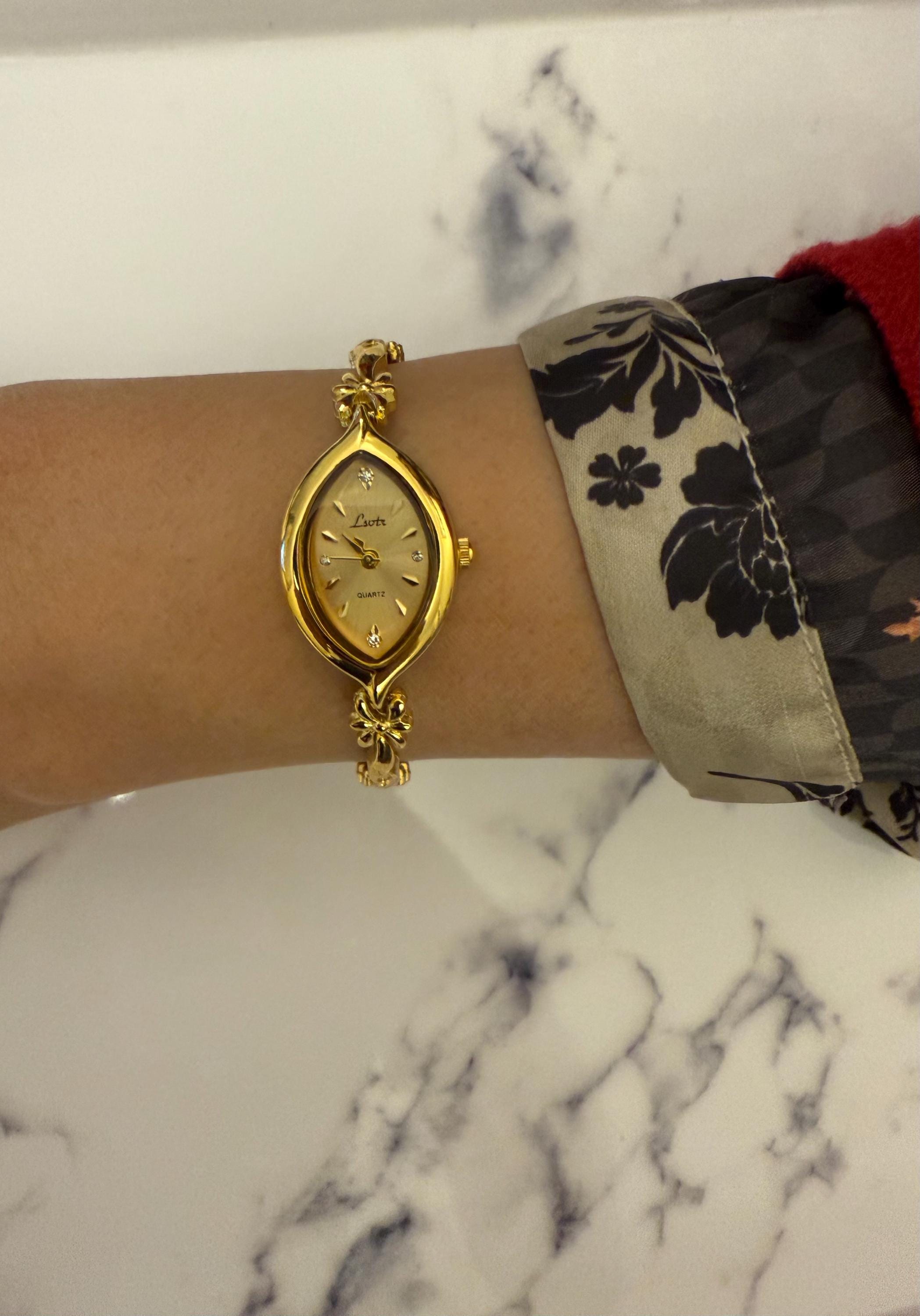 Dainty gold bows watch