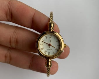 gold bangle watch