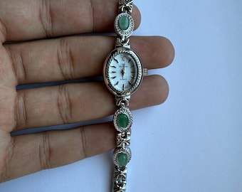 silver green stones and ribbons watch