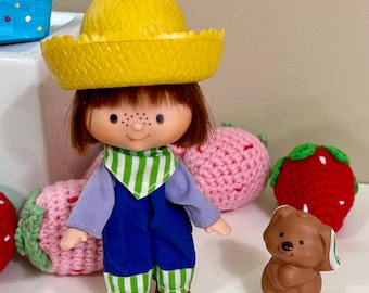 Strawberry Shortcake 1979 American Greetings Huckleberry Pie Doll with his pet Pupcake.