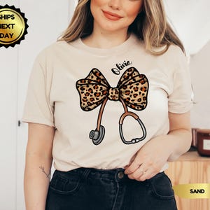 Personalize Coquette Nurse Shirt, T-Shirt or Sweatshirt, Nurse Graduation, Healthcare, Leopard Print Stethoscope Bow, Gift for Nurse