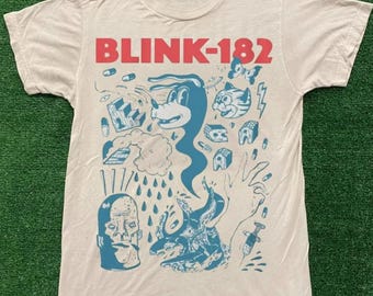 Camiseta Comfort Colors® Blink 182, camiseta con cara sonriente, camiseta retro con cara sonriente, camiseta con sonrisa adorable, camiseta Blink 182 Rock, camiseta moderna