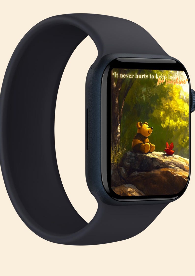 May include: A black Apple Watch with a black sport band. The watch face displays a cartoon image of Winnie the Pooh sitting on a rock in a forest with the text "It never hurts to keep looking for sunshine."