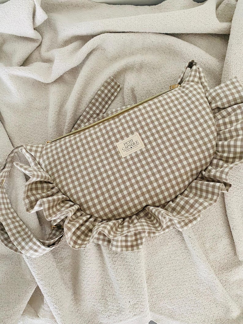 Beige gingham ruffle crescent shoulder bag for women, everyday handbag. gold zipper and adjustable strap.