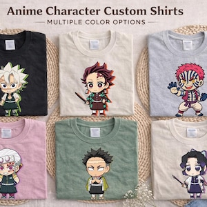 May include: Six t-shirts with anime character designs. The shirts are black, cream, grey, pink, green, and cream. Each shirt features a different character illustration. The text "Anime Character Custom Shirts - MULTIPLE COLOR OPTIONS" is at the top.