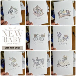 May include: A set of nine illustrated cards with watercolor drawings. The cards are designed for a new baby and have phrases like "deeper delivery", "date night in", "sleep time", "food delivery", "treat yourself", "sweet treat", "coffee with friend", and "quiet time".