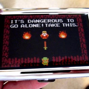Porte-cartes ou portefeuille Zelda 8 bits Its Dangerous to Go Alone
