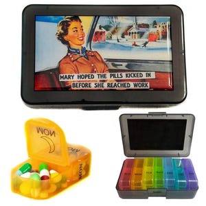 May include: A black pill box with a colorful image of a woman driving a car and the text "Mary hoped the pills kicked in before she reached work". The pill box has a separate compartment for daily pills and a smaller compartment for weekly pills.