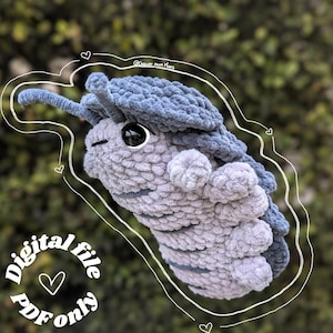 May include: A crocheted plush toy shaped like a pill bug. The toy is gray and blue with a large black eye. The toy is surrounded by a white outline with hearts. The text "Digital file PDF only" is written in a circle around the toy.