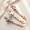 Custom Name Pacifier Holder with Crochet Animal, Personalized Baby Accessory, Handmade Newborn Keepsake and Baby Shower Present product logo