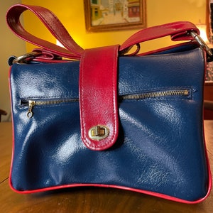 Vintage blue and red vinyl shoulder purse.