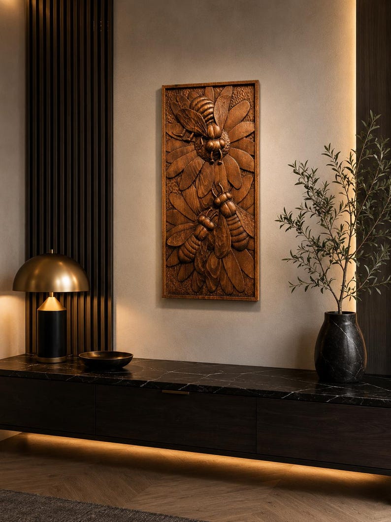 May include: A rectangular wooden wall art piece with a detailed relief carving of bees and flowers. The artwork is in shades of brown and is mounted on a neutral-coloured wall. The piece adds a natural element to the room's decor.