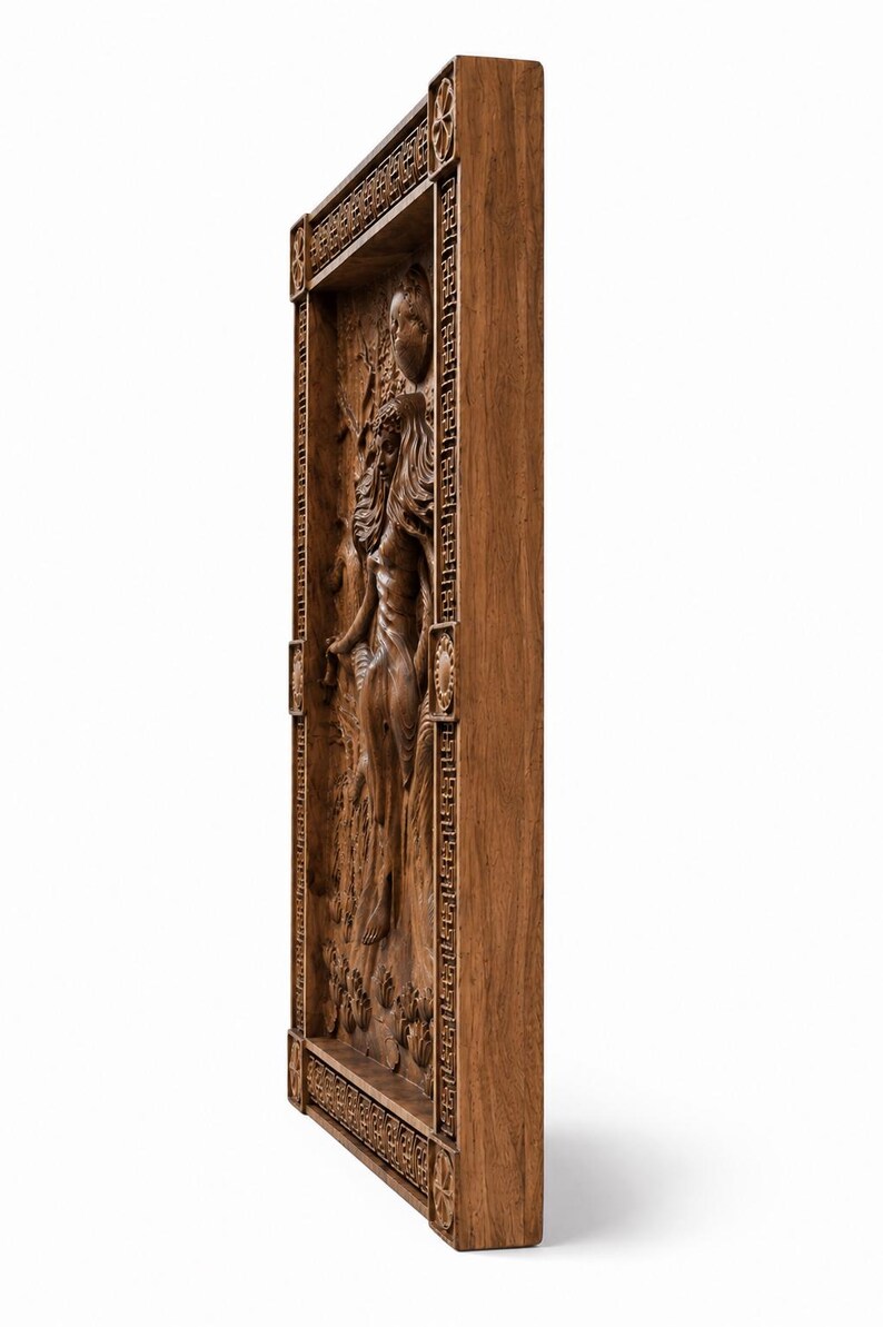 May include: A detailed, wooden relief carving depicting a classical female figure in a framed rectangular panel. The relief is carved in a warm brown tone, with intricate details in the figure's hair, clothing, and the surrounding floral elements.