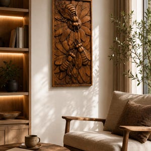 May include: A rectangular wooden wall art piece with a detailed relief carving of two bees and stylized flowers. The artwork is stained a warm brown colour and is mounted on a neutral-coloured wall. The piece adds a natural, rustic element to the room.
