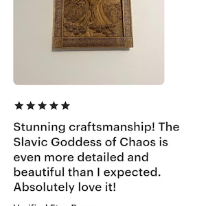 May include: A wooden carving of the Slavic Goddess of Chaos, framed with an ornate border. The artwork depicts a female figure with flowing hair, surrounded by a tree and other natural elements. The carving is detailed and intricate.