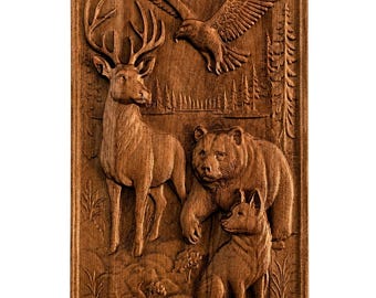 May include: A rectangular wooden wall plaque featuring a detailed relief carving of a deer standing on the left, a bear in the center, a wolf sitting in the foreground, and an eagle flying above, all set against a forest background.