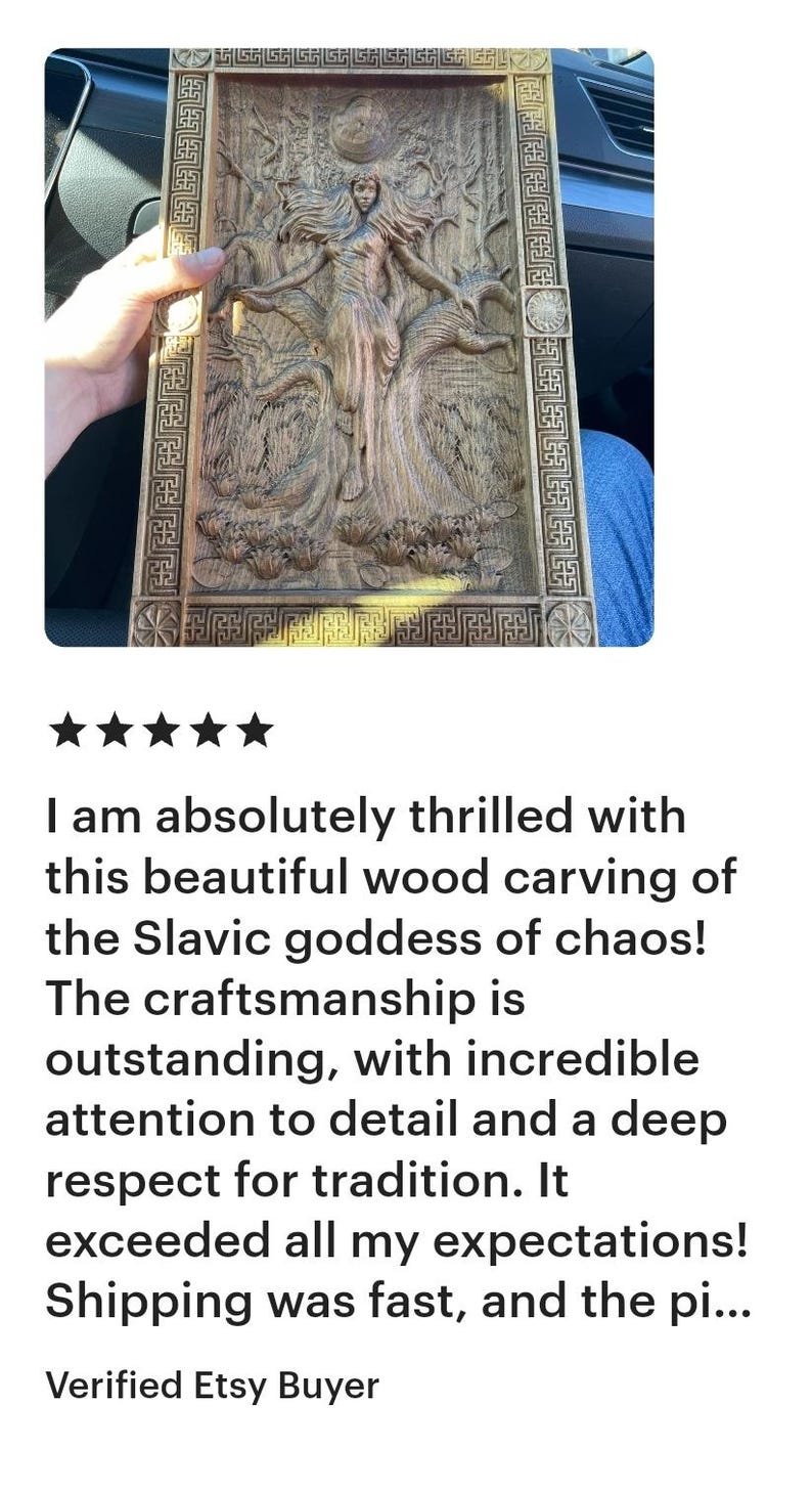 May include: A detailed wood carving depicting a Slavic goddess, framed in a rectangular border. The artwork features intricate relief carvings of figures and natural elements, showcasing fine craftsmanship.