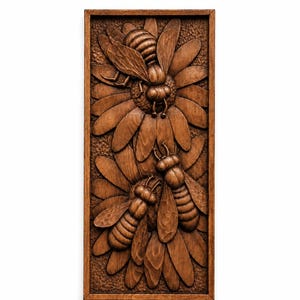 May include: A rectangular wooden relief carving depicting three bees on a flower. The bees are intricately carved with detailed wings and bodies. The flower has multiple petals. The artwork is framed in a dark wood.