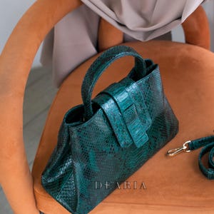 Top handle python leather bag with magnetic closure detail