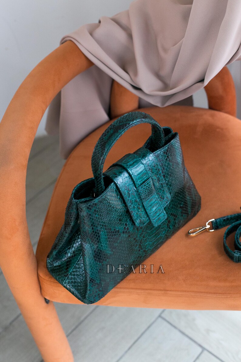 Top handle python leather bag with magnetic closure detail