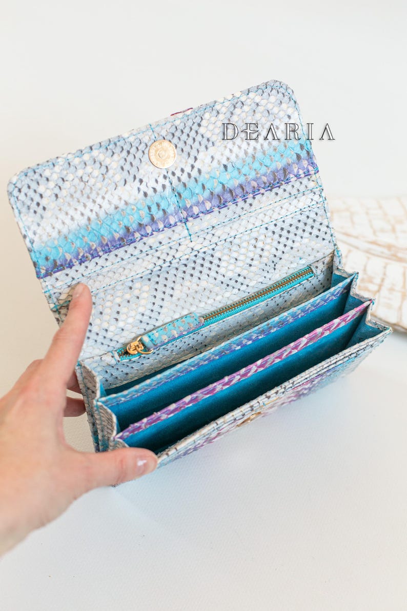 open python leather wallet with card slots, bill compartments and zip pocket inside