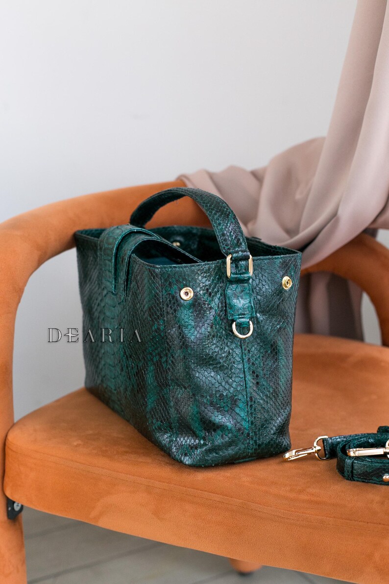 Side view of emerald python handbag showing soft structure