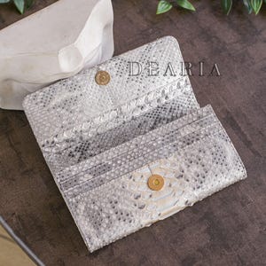 Interior of python wallet women's lined in python leather for a fully premium feel.