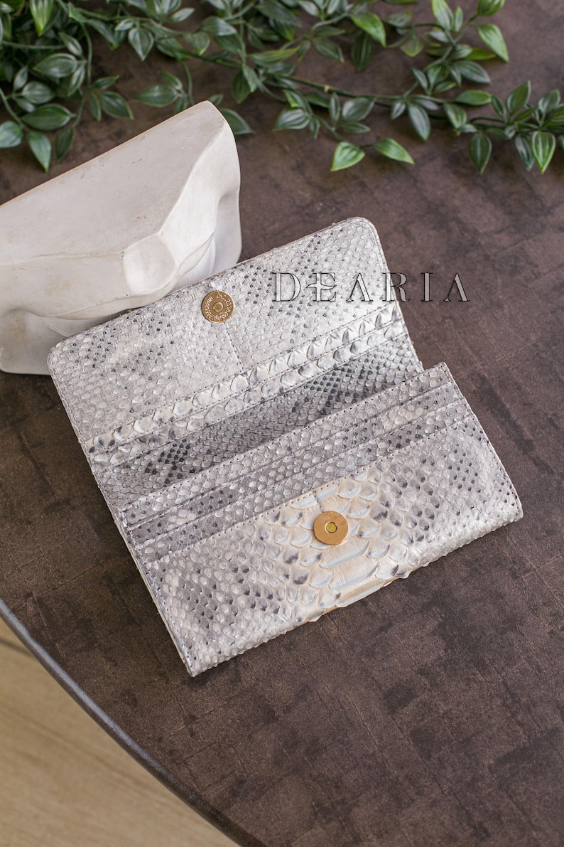 Interior of python wallet women's lined in python leather for a fully premium feel.