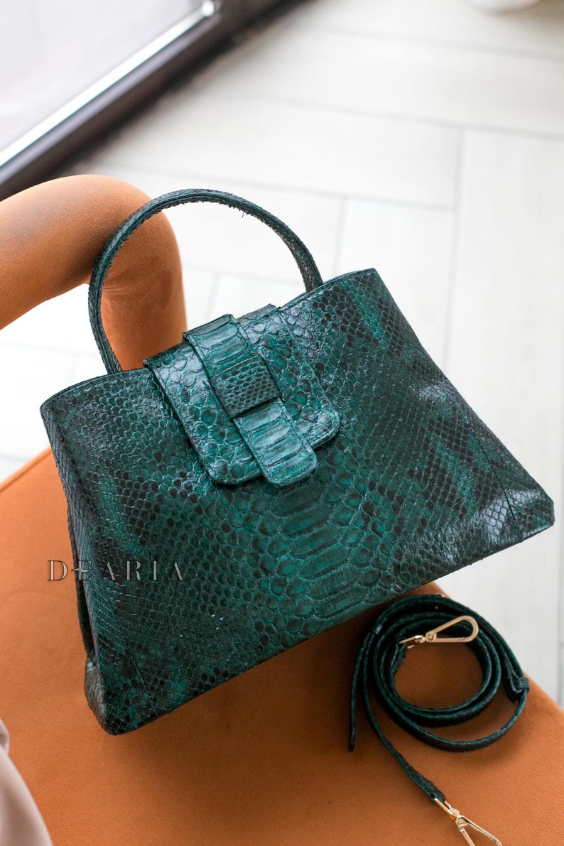 Women’s snakeskin handbag showing rich emerald green color