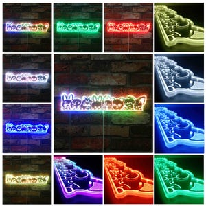 May include: A collection of neon signs featuring cartoon animal characters. The signs are in various colors, including green, red, blue, and white. The signs are mounted on a brick wall and have a whimsical design.