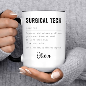 May include: White ceramic mug with black text that reads "SURGICAL TECH noun (n) Someone who solves problems you never knew existed in ways that will blow your mind; See also: ninja; badass; legend Olivia"