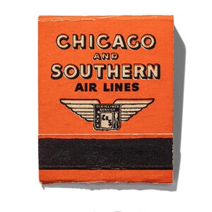 May include: An orange matchbook cover with black text that reads "CHICAGO AND SOUTHERN AIR LINES" and a black and white illustration of a winged airplane with the text "DIXIELAND SERVICE" above it.
