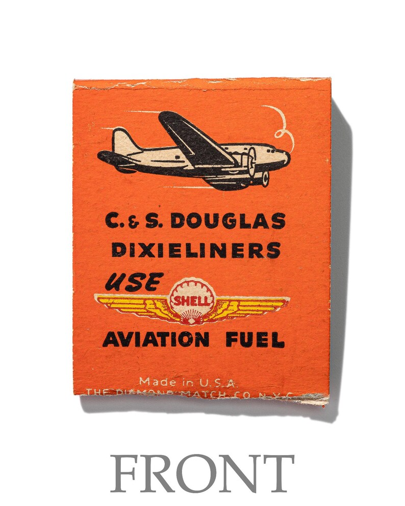 May include: Orange matchbox with a black and white illustration of a plane and the text "C. & S. DOUGLAS DIXIELINERS USE SHELL AVIATION FUEL Made in U.S.A. THE DIAMOND MATCH CO. N.Y.C."