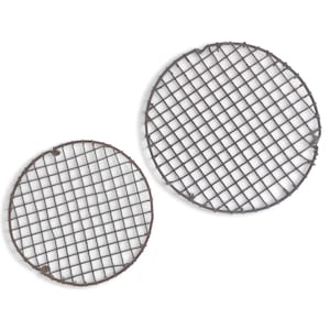 May include: Two round, rusty metal grill grates with a diamond pattern. The grates are made of dark brown metal and are set against a white background. The grates are likely for cooking.
